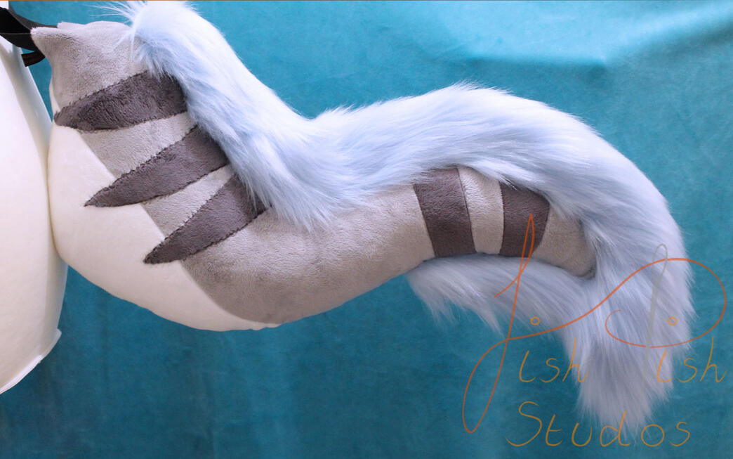 Custom Furry Tail 'XYX' A silvery grey tail with darker grey stripes, a white belly and baby blue faux fur trim. Made from minky and luxury faux fur for fursuits, larp and therian costumes