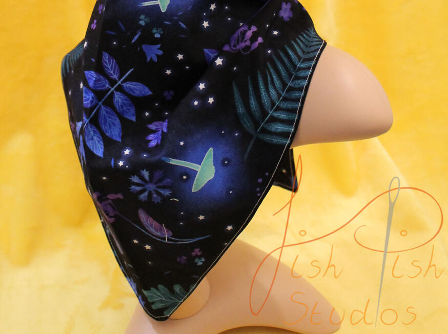 A blue shaded bandana with glowing leaves and mushroom decorations. Extra large in size for fursuit accessories or everyday fashion wear