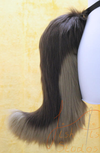 A smaller, more delicate version of our wolf tail. This one also attaches via belt loops but is 16 inches long. It hangs down, is made from luxury faux fur and is handmade in the UK by FishPish Studios. This colours used on this one are brown and cocoa