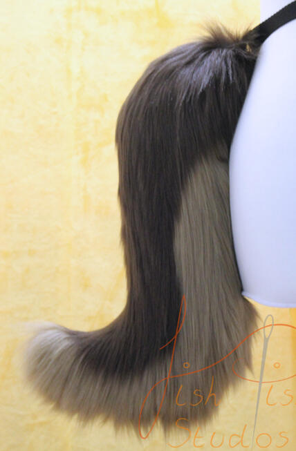 Small Wolf Tail A smaller, more delicate version of our wolf tail. This one also attaches via belt loops but is 16 inches long. It hangs down, is made from luxury faux fur and is handmade in the UK by FishPish Studios. This colours used on this one are brown and cocoa