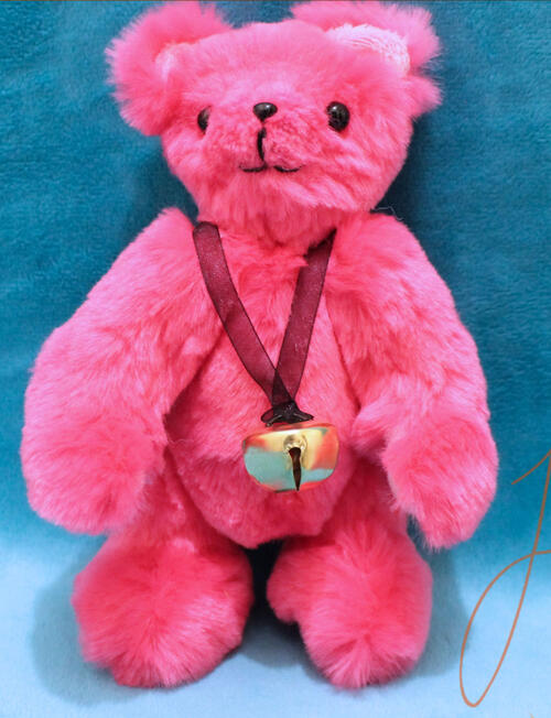 A cute, jointed pink teddy sporting a bell necklace. This cutie is big enough to hug but small enough to travel. Made with luxury faux fur and minky fabrics. handmade in the UK by fishpish studios