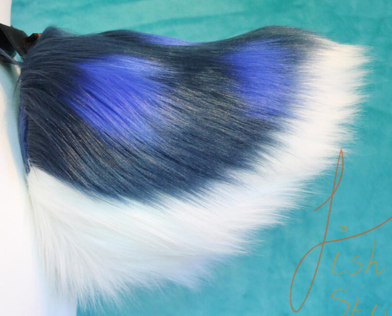 Great for deer styled larp costumes or therians, this tail is made from luxury faux fur for a soft touch. The design's colours can be swapped out for others. This one is Navy with a white base and royal blue spots. It connects via belt loops to a belt (not