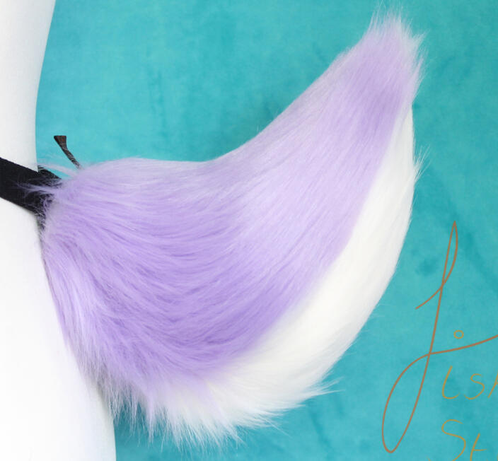 Great for fawns, deer and rabbit fursuiters and larpers alike. This tail attaches via belt loops to a belt (not supplied) and is made from luxury faux fur. It is handmade in the UK by FishPish studios. This particular tail is a lilac base with white unders