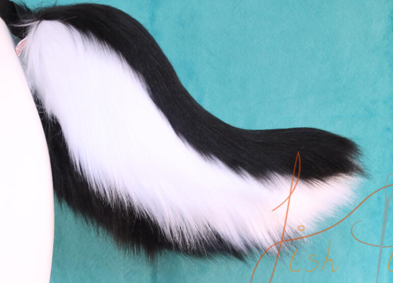 A small black and white styled skunk tail for those wanting a smaller tail for their costume. Made of luxury faux fur in the UK by fishpish Studios