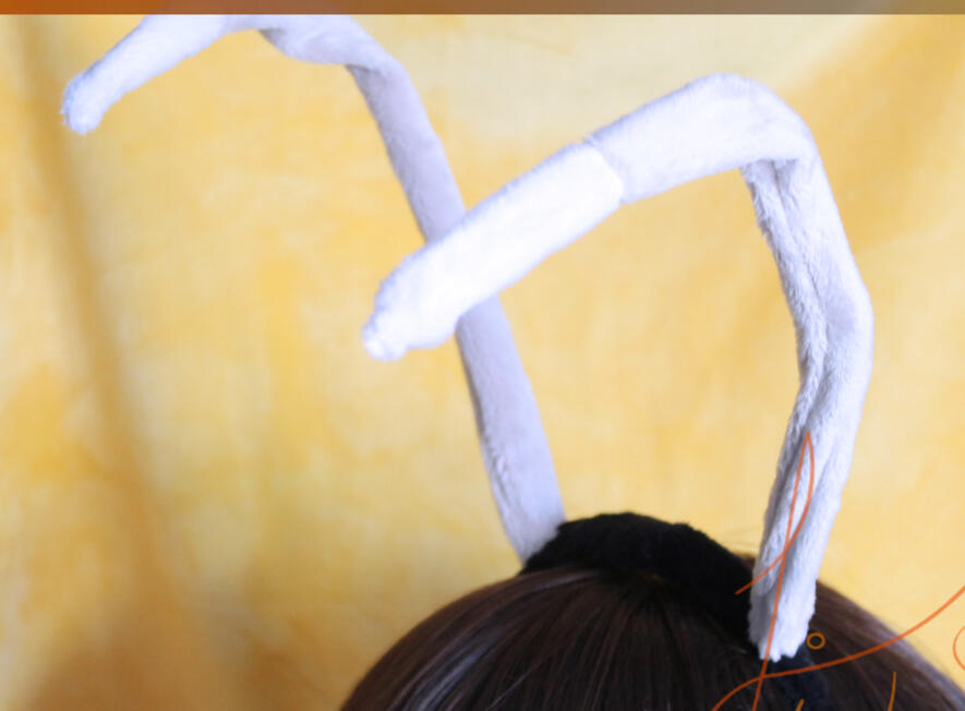 A three coloured version of the thin tipped antenna available in store. Made of baby pink, lilac and black fabric. The antenna has a wire core for posing and is on a headband. handmade by fishpish studios in the UK