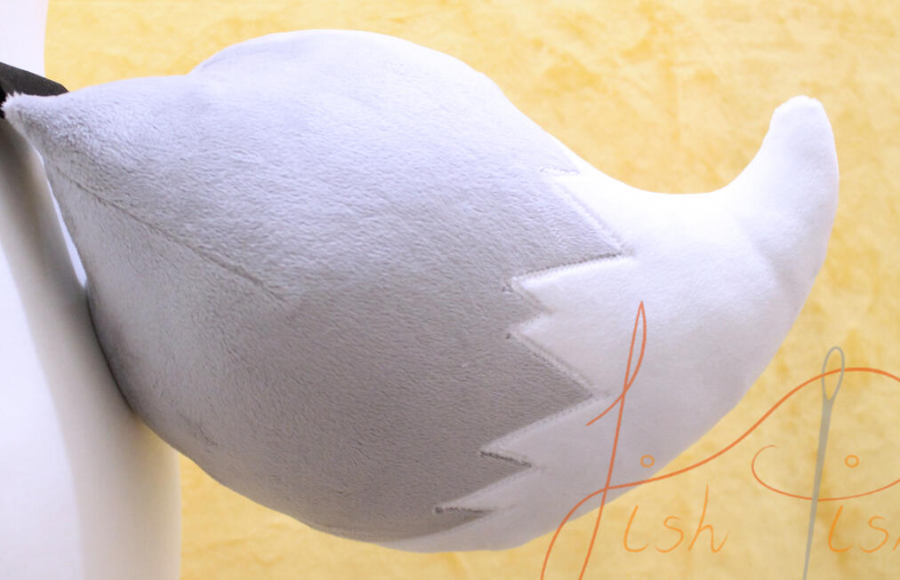 Eevee Styled Fox Tail made of soft plush fabric, this eevee styled, fox tail is great for demon girls and pokemon fans alike. Small enough to add a little flair but big enough to be impressive. This one is made of platinum silver and white minky type fabric. It connects with be