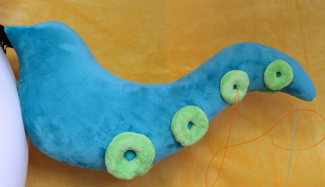 A unique style of tail, this one sports a solid colour base with different coloured suckers. Different colour combinations are available via the store, but more complex version will need commissioning. Handmade in the UK by fishpish studios