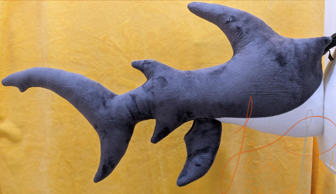Shark Tail A 27 inch long dark grey and white shark tail made of soft plush fabric. It connects to a belt using belt loops and is available in a wide range oc colour combinations. Available via our store, they are handmade by fishpish studios