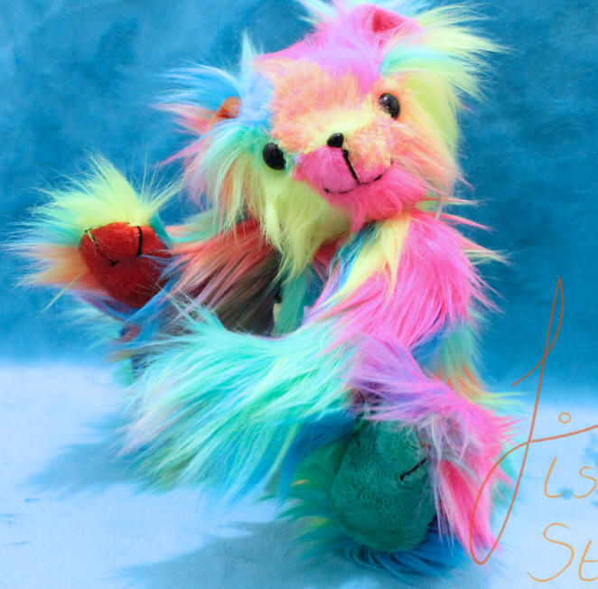 A cute, jointed rainbow teddy sporting a star necklace. This cutie is big enough to hug but small enough to travel. Made with luxury faux fur and minky fabrics. handmade in the UK by fishpish studios