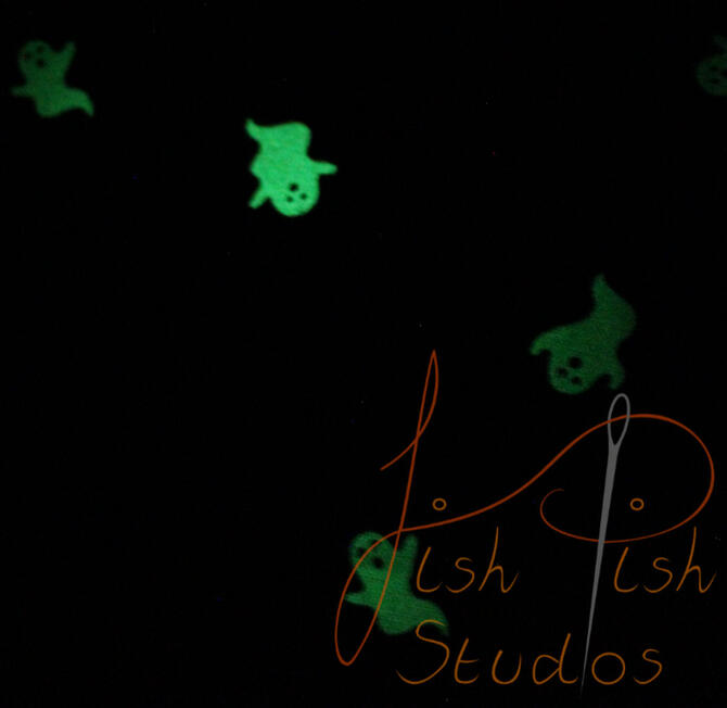 Ghost glow a close up showing the glowing ghosts on the fursuit bandana. The fabrics are polycotton. The design is XL at 36 inches, making it a great fashion accessory or something to decorate your fursuit. handmade in the UK by fishpish studios