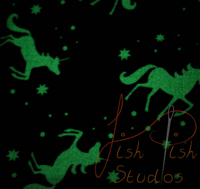 a close up showing the glowing unicorns on the fursuit bandana. The fabrics are polycotton. The design is XL at 36 inches, making it a great fashion accessory or something to decorate your fursuit. handmade in the UK by fishpish studios