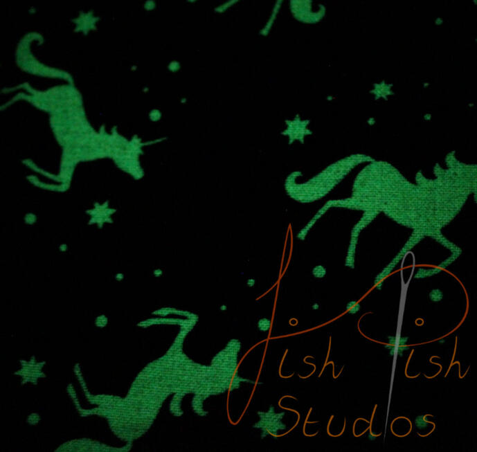 Unicorn Glow a close up showing the glowing unicorns on the fursuit bandana. The fabrics are polycotton. The design is XL at 36 inches, making it a great fashion accessory or something to decorate your fursuit. handmade in the UK by fishpish studios