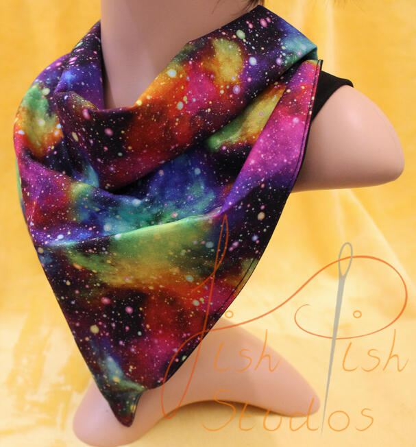 an XL bandana in a multi colour galaxy print. The fabrics are polycotton. The design is XL at 36 inches, making it a great fashion accessory or something to decorate your fursuit. handmade in the UK by fishpish studios