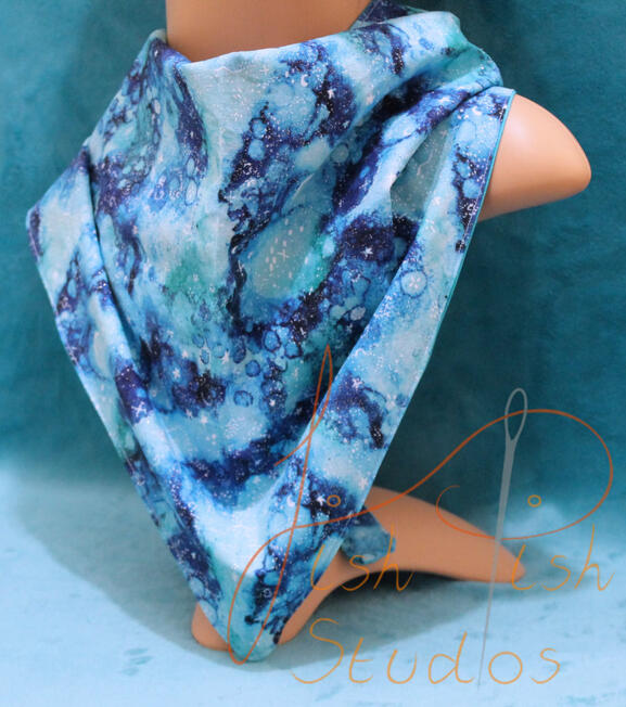 an XL bandana in a wavy sea blue colour. The fabrics are polycotton. The design is XL at 36 inches, making it a great fashion accessory or something to decorate your fursuit. handmade in the UK by fishpish studios