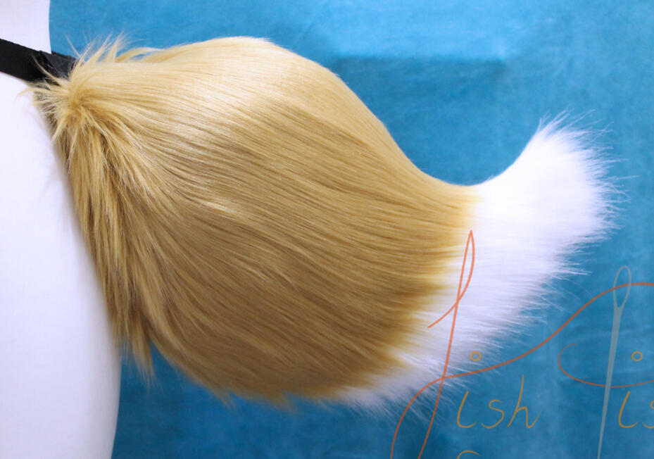 Tamamo No Maw Demon Fox Tail A luxury faux fur demon fox tail, this one in caramel and white. It's soft fabric is smooth the the touch and can be customised in a variety of colours available in the store. Handmade by fishpish studios in the UK
